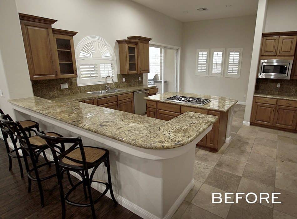 Kitchen with granite countertops, wooden cabinetry, and bar stools before renovation