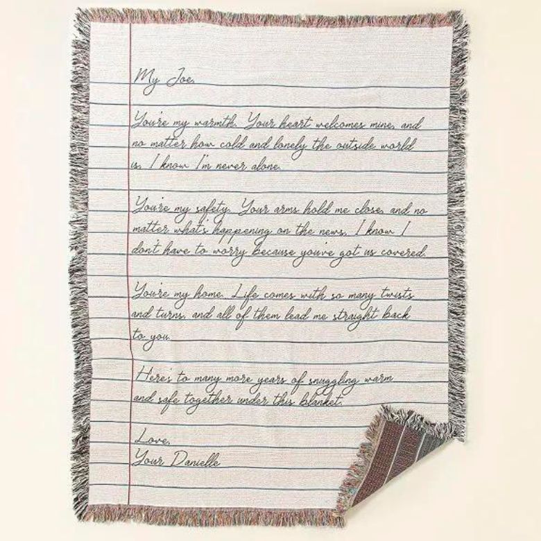 Notebook-style blanket with a handwritten love letter from Danelle