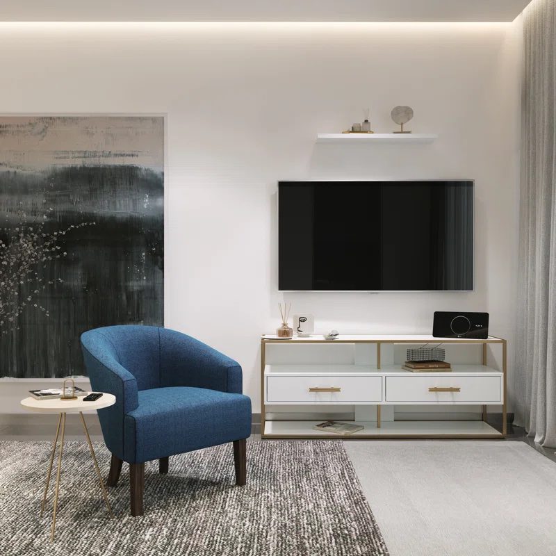 Modern living space with blue accent chair, TV console, and wall-mounted TV