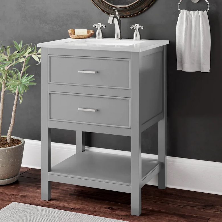 Gray bathroom vanity with two drawers, white countertop sink, and silver faucet
