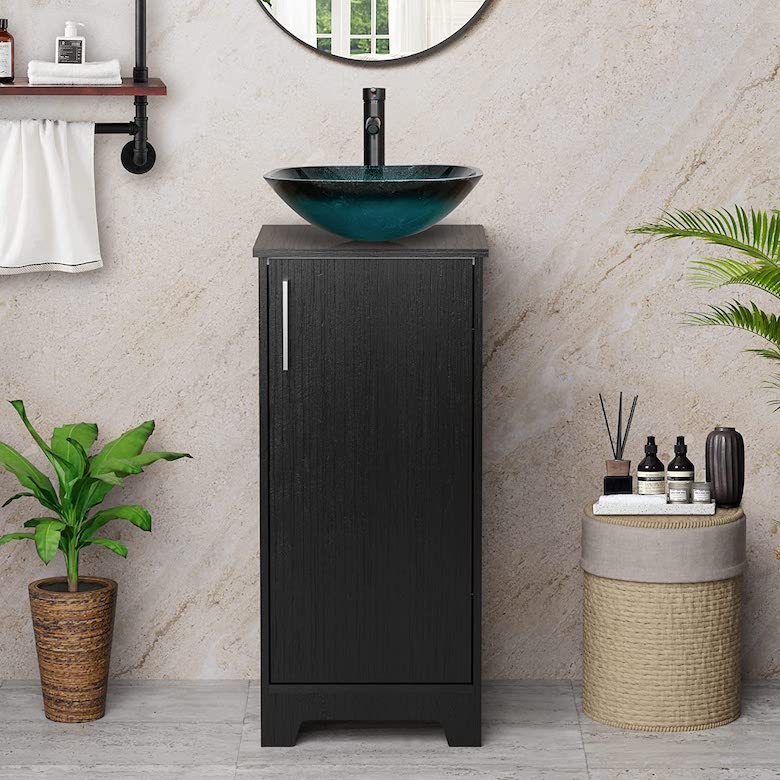 Black bathroom vanity with a teal glass vessel sink and single door cabinet