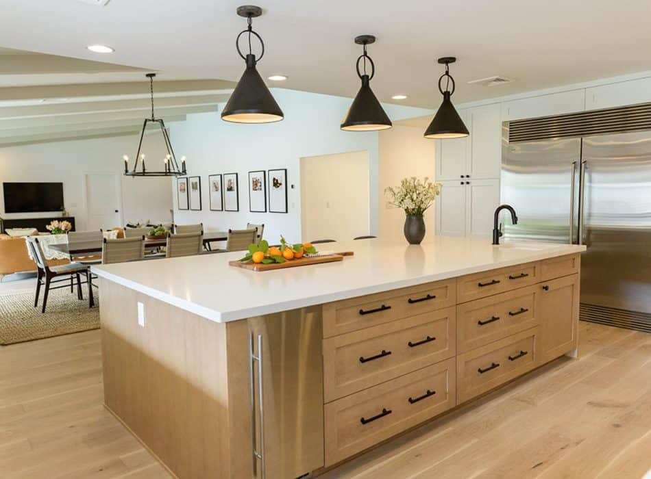 Modern kitchen interior with a large central island and pendant lights
