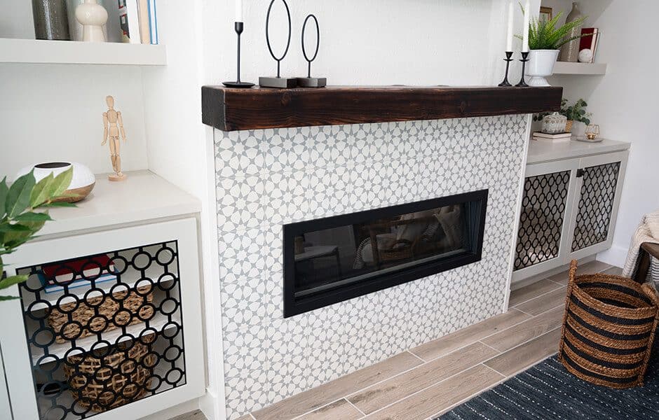 Modern fireplace with geometric tile and wooden mantel