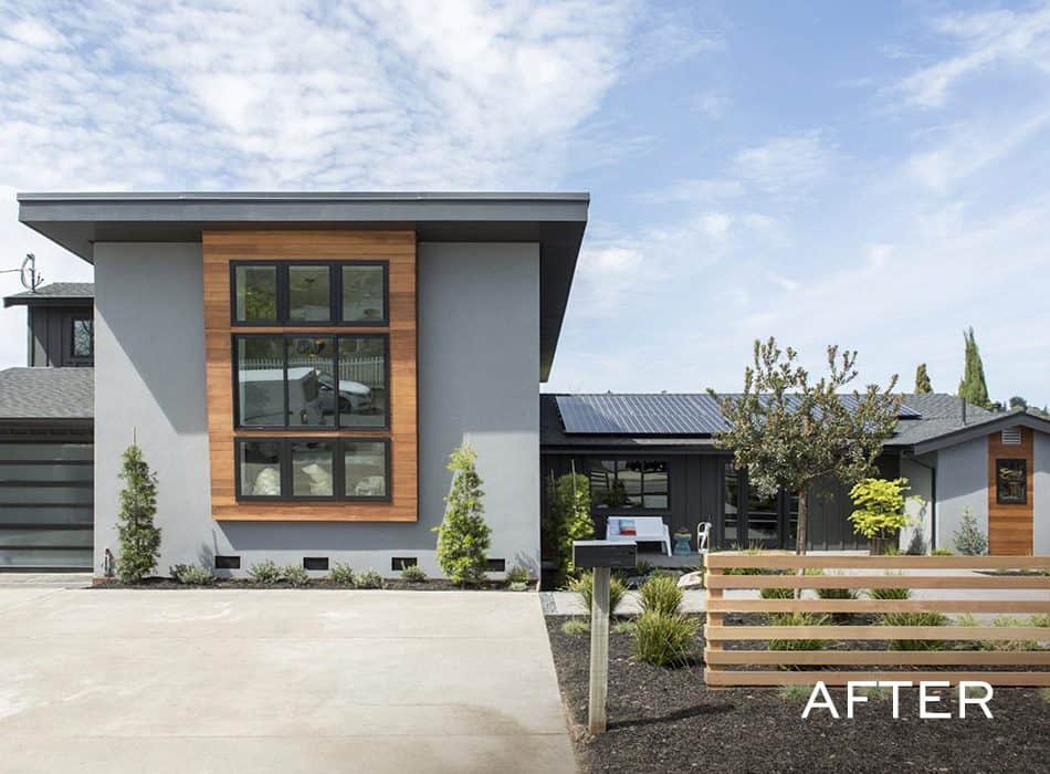 Modern gray house with large wood-framed windows and minimal landscaping