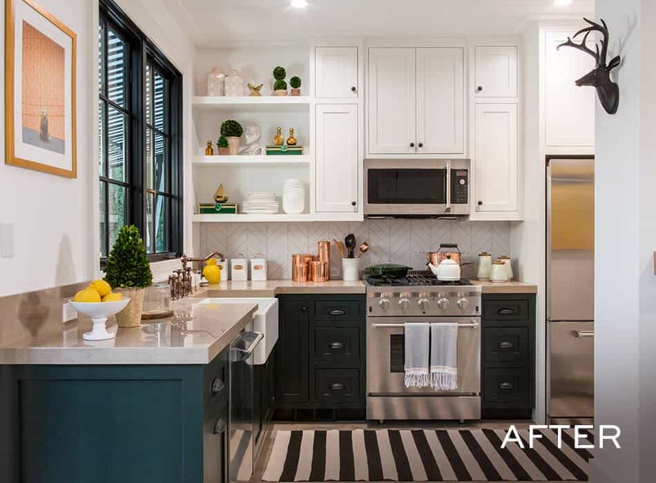 Modern kitchen with white cabinets, stainless steel appliances, and striped rug