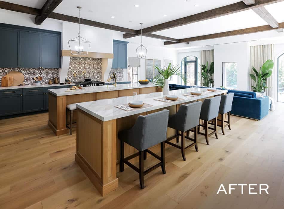 Spacious kitchen with large island, patterned backsplash, exposed beams, and seating