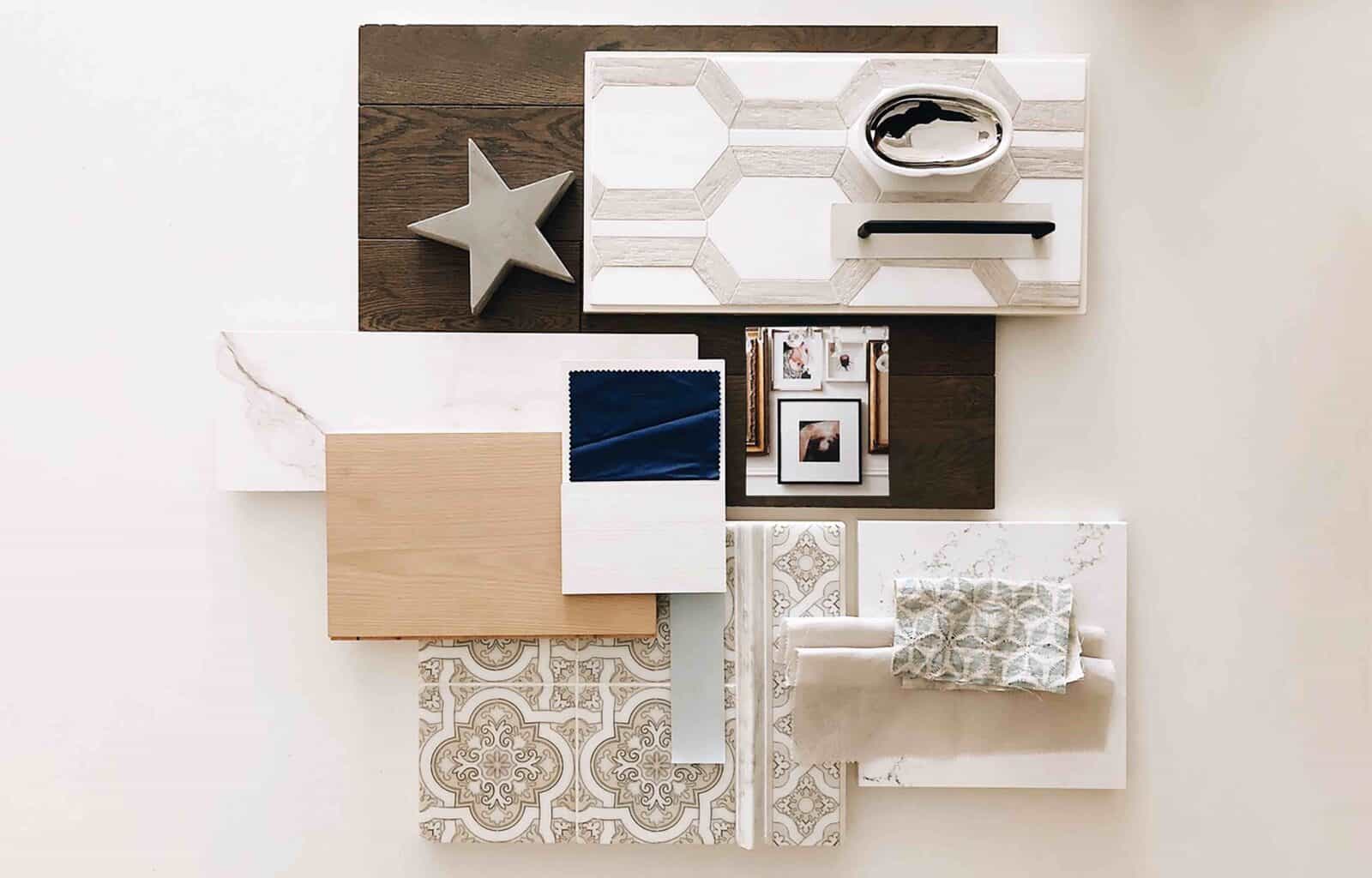A mood board featuring various like marble, wood, tile, fabric swatches, a star decoration, and a framed photo