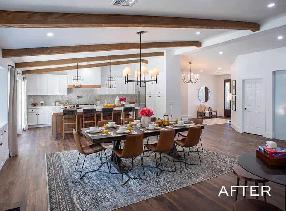 Renovated dining and kitchen area with wooden beams, modern furniture, and stylish decor