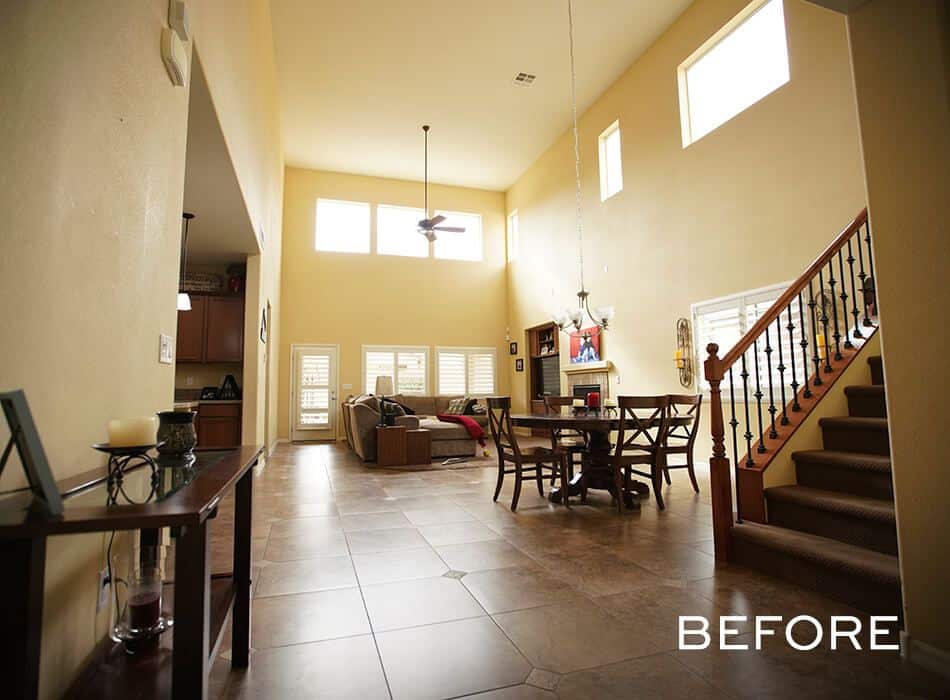Open living and dining area with high ceilings and tiled floors