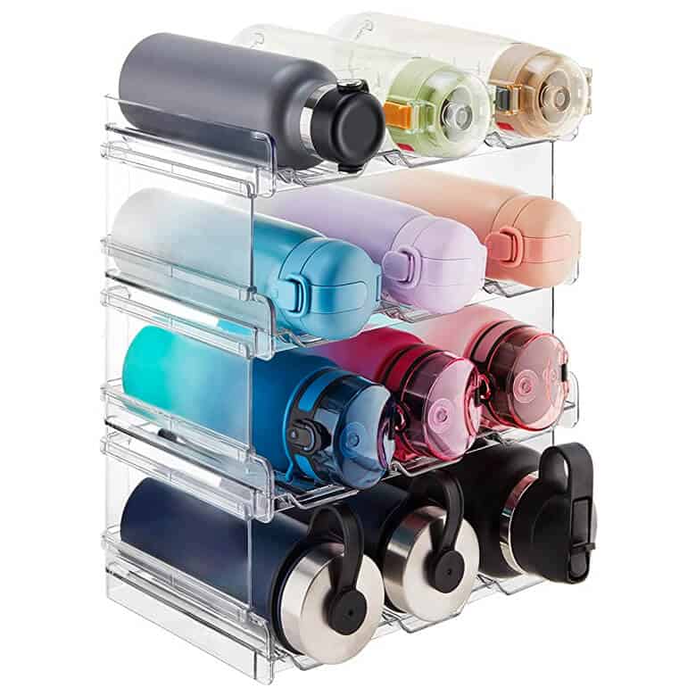 A clear plastic organizer holding several colorful water bottles of different sizes and shapes