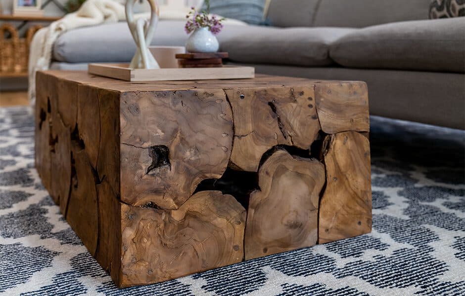Rustic wooden coffee table with a natural, textured design in a cozy living room