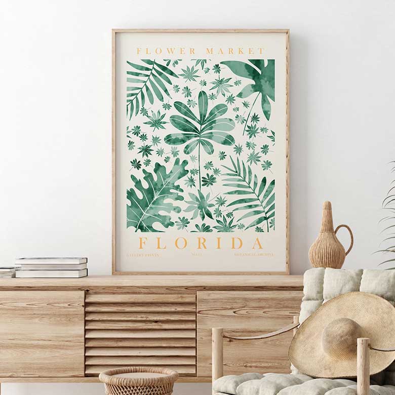 Framed botanical artwork labeled 'Flower Market Florida' displayed above a wooden console