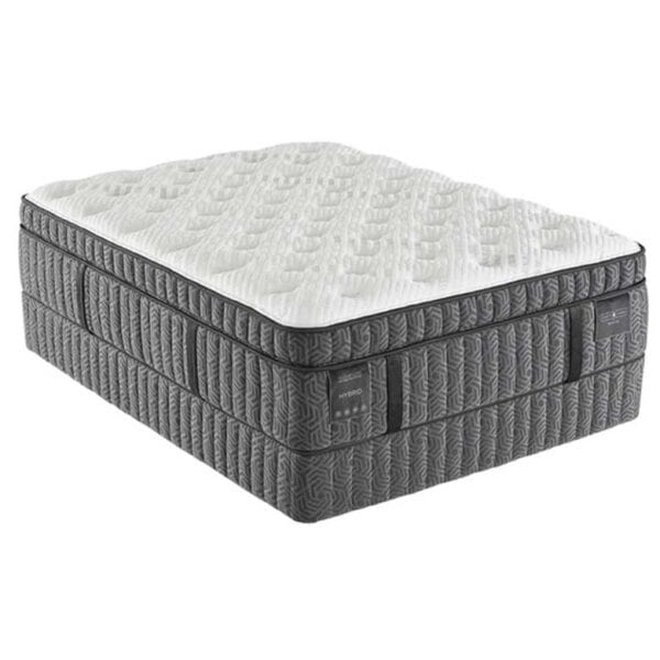 Thick gray and white hybrid mattress with a quilted top and textured sides