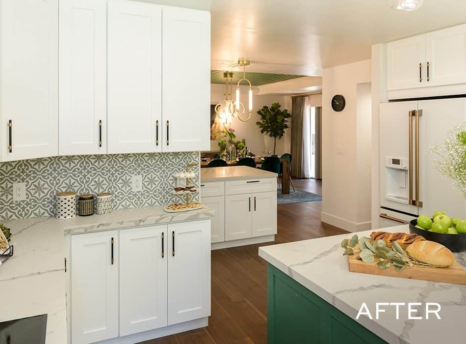 Kitchen with white cabinets, patterned backsplash, and green island