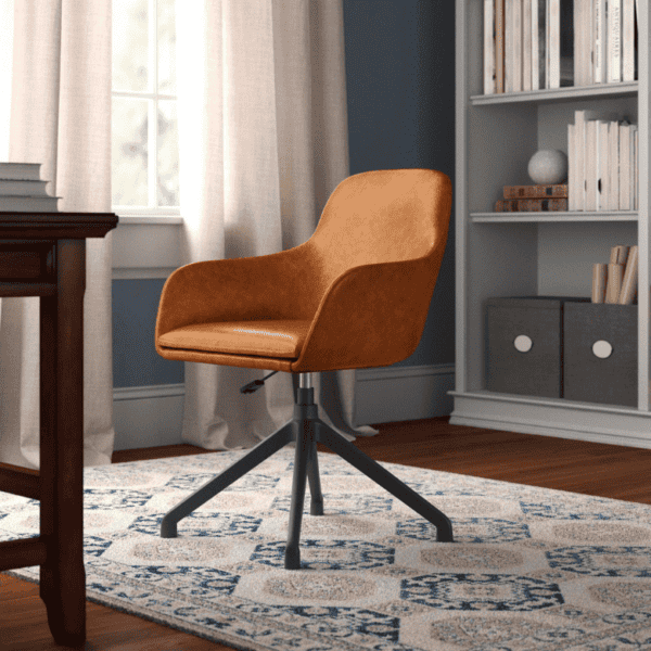 Home office with a brown swivel chair, patterned rug, and bookshelf