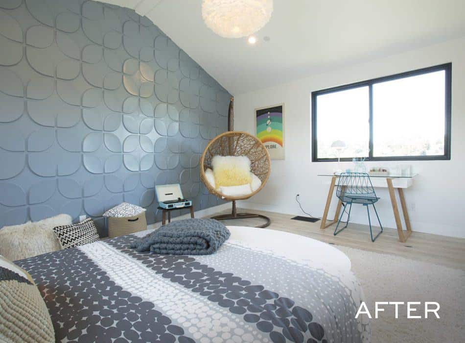 Modern bedroom with a patterned comforter and a unique accent wall.
