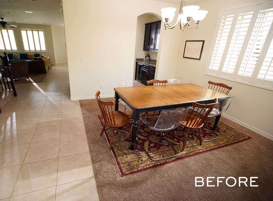 Traditional dining room with mixed chairs, a wooden table, and a chandelier