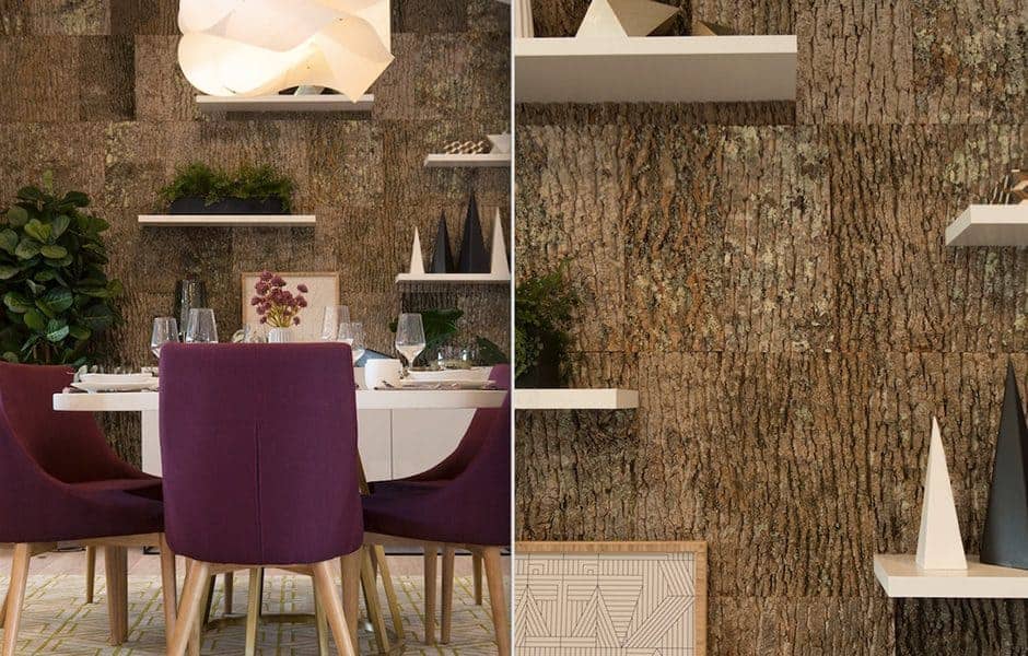 Dining room with a bark-textured accent wall, purple chairs, white dining table, and floating shelves