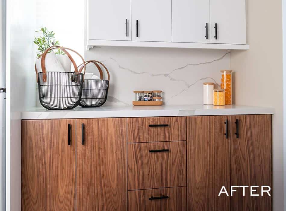 An after image of a Kitchen with modern wood and white cabinets, marble backsplash, and organized counter decor