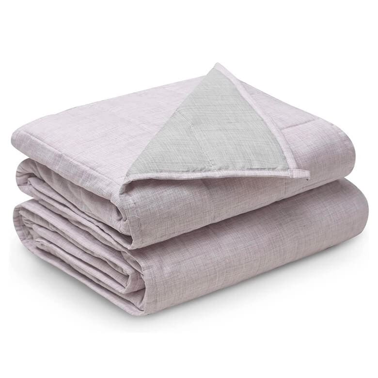 Folded light lavender weighted blanket with a soft textured fabric