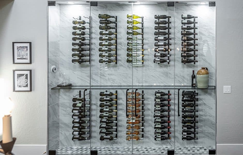 Glass-enclosed wine rack with marble backing and modern bottle display