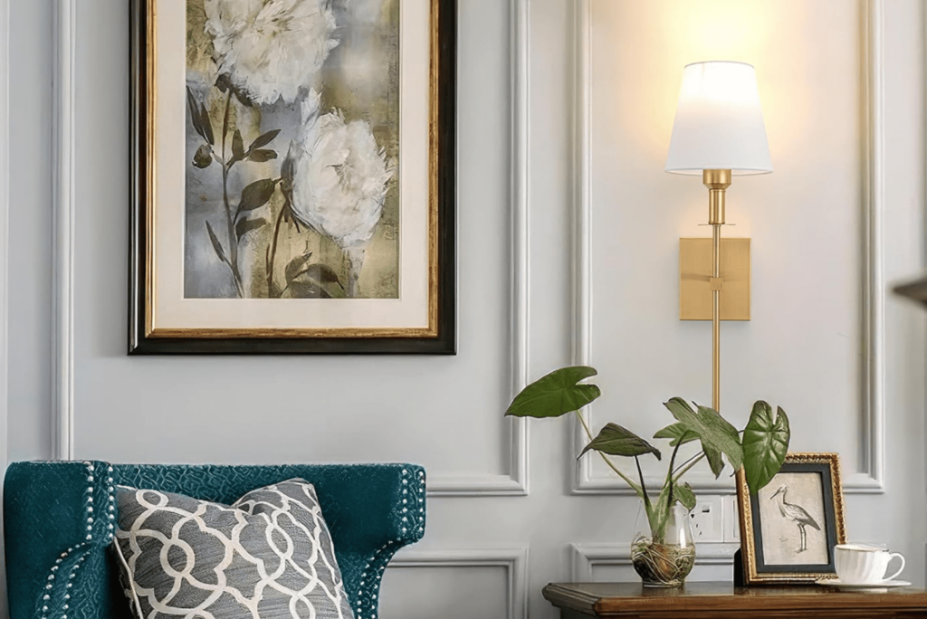 Stylish living room corner with a teal armchair, a small table, and wall painting with flowers