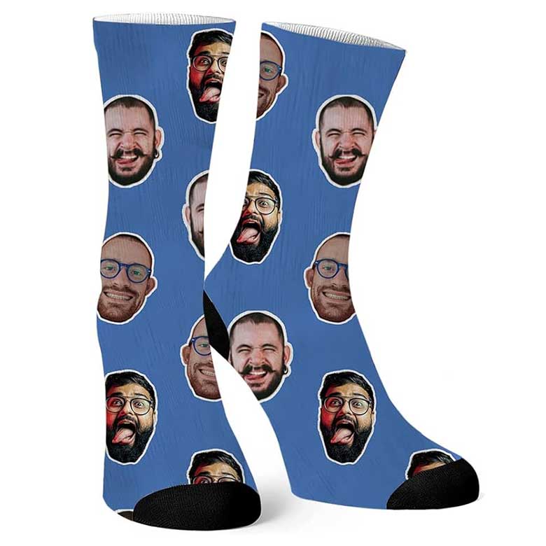 Blue socks with repeated prints of a man’s face showing various funny expressions
