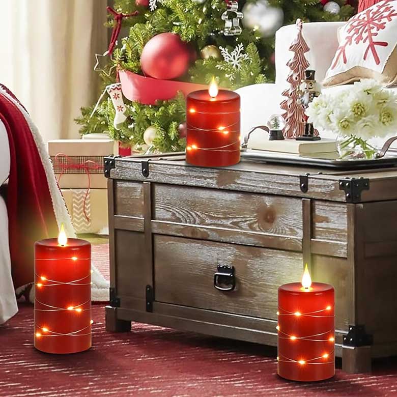 Cozy holiday living room with red LED candles, wooden chest coffee table, and decorated Christmas tree