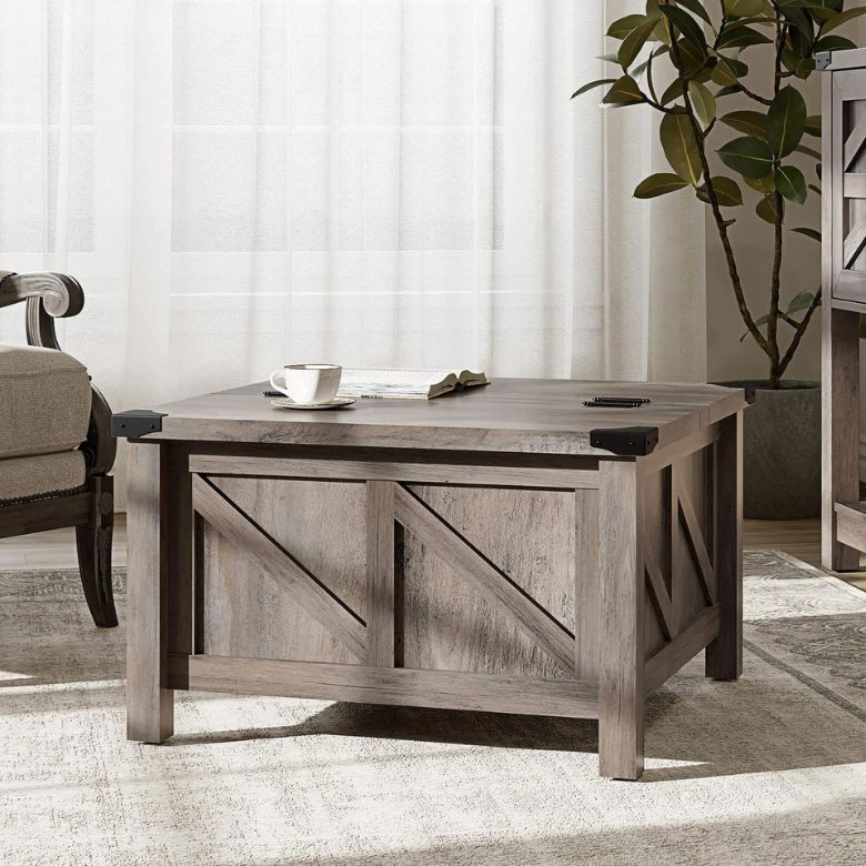Rustic wooden coffee table with X-panel design and metal corner accents in a cozy living room