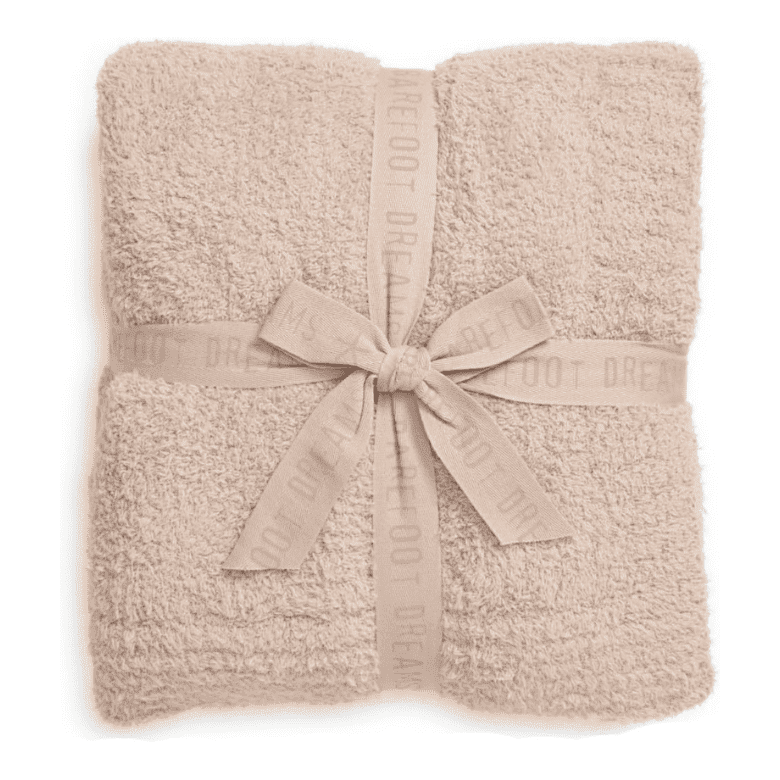 barefoot dreams throw blanket in peach