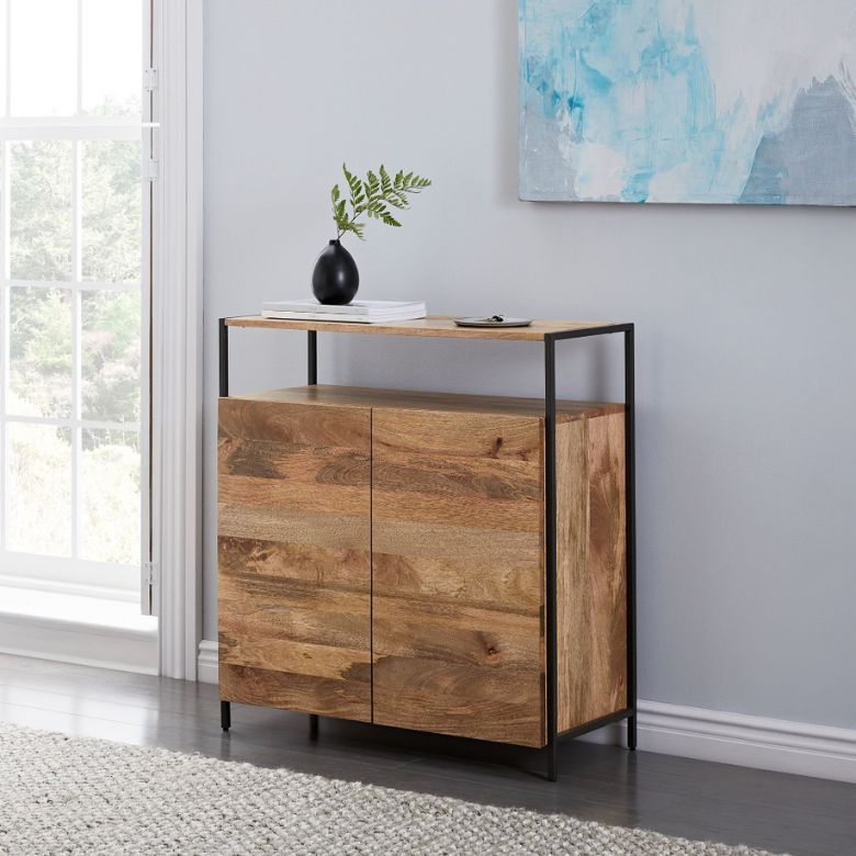 Small wooden cabinet with a black metal frame and open shelf, decorated with a black vase and books