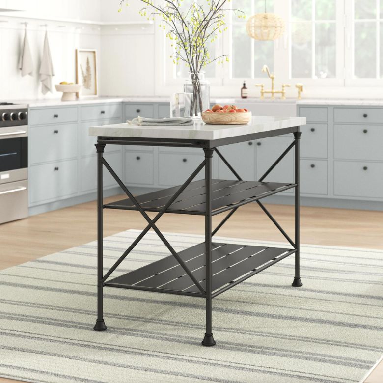 Kitchen island with a marble top, black metal frame, and two open shelves on a striped rug.