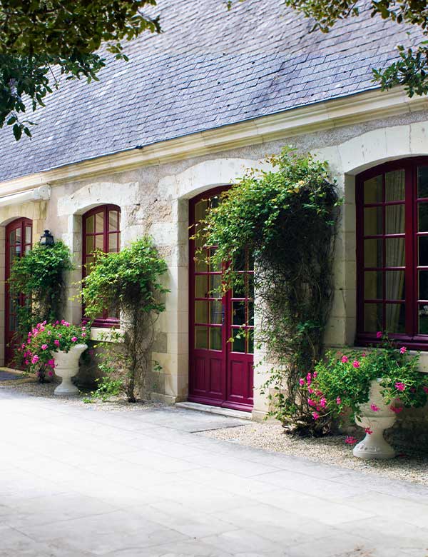 home entry with flowers and a beautiful door