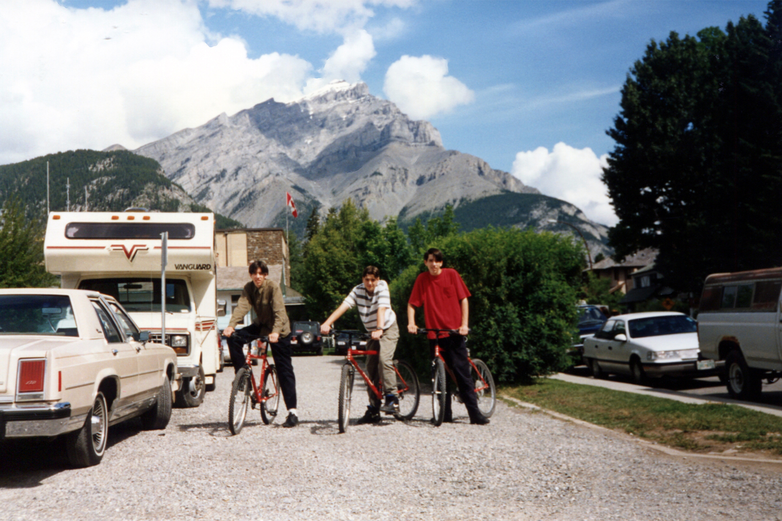 drew scott and jonathan scott riding bikes in front of a mountain in 1993