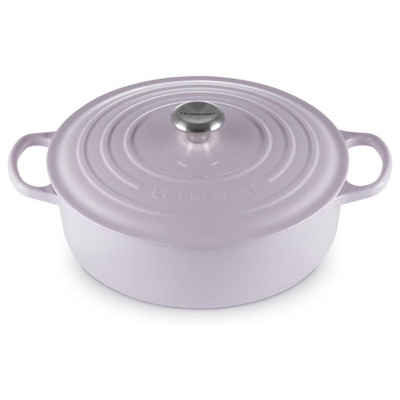 Light lavender Le Creuset Dutch oven with a stainless steel knob and side handles.