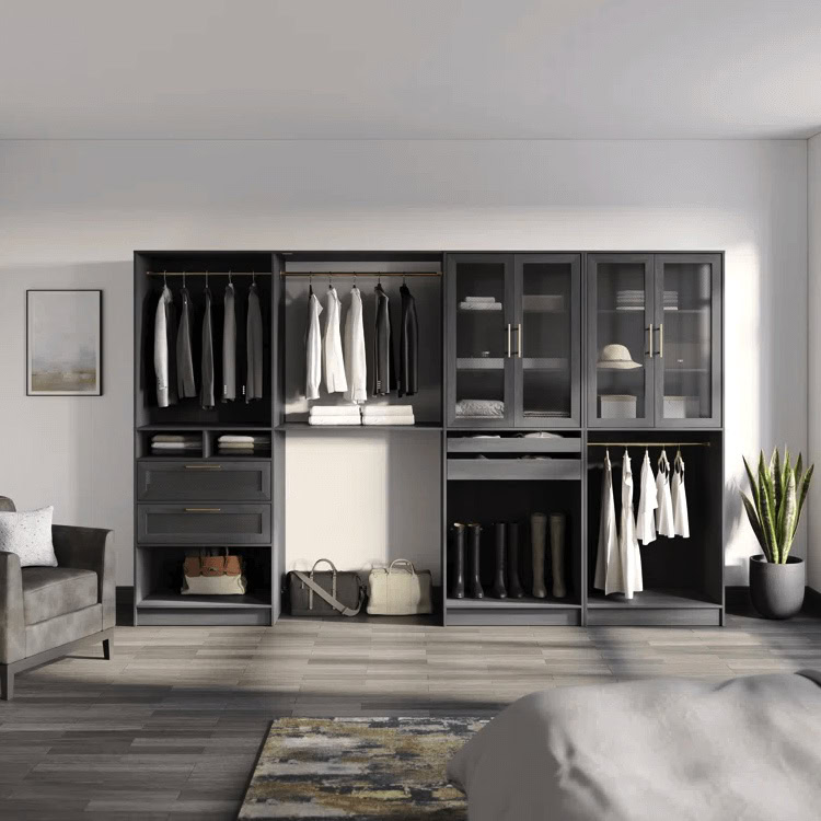 Modern open closet system with hanging clothes, shelves, drawers, and boots arranged neatly.