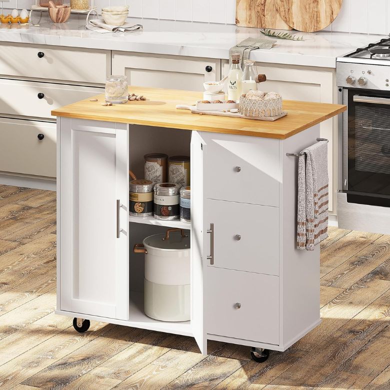 White kitchen island on wheels with open storage showing jars and cookware, topped with a wooden countertop.