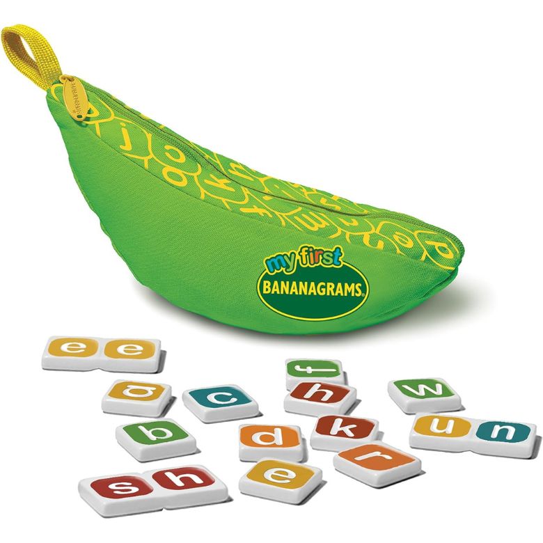 “My First Bananagrams” green banana-shaped pouch with colorful letter tiles scattered in front.