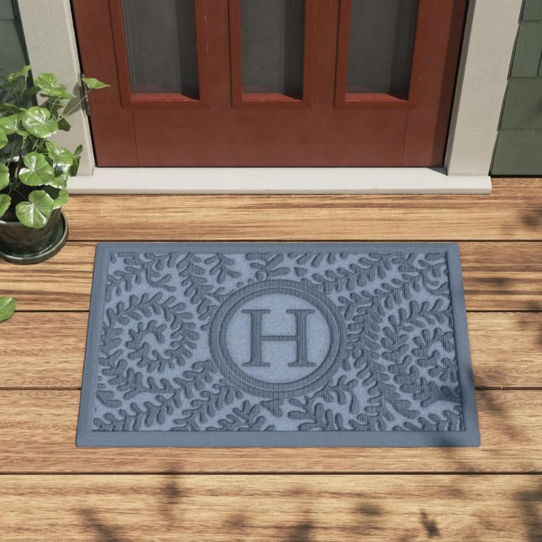 Stack of art books with a gold wishbone sculpture on top.