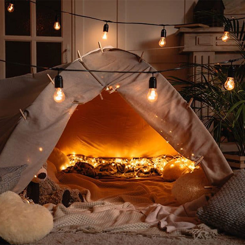 camping with a tent in the living room