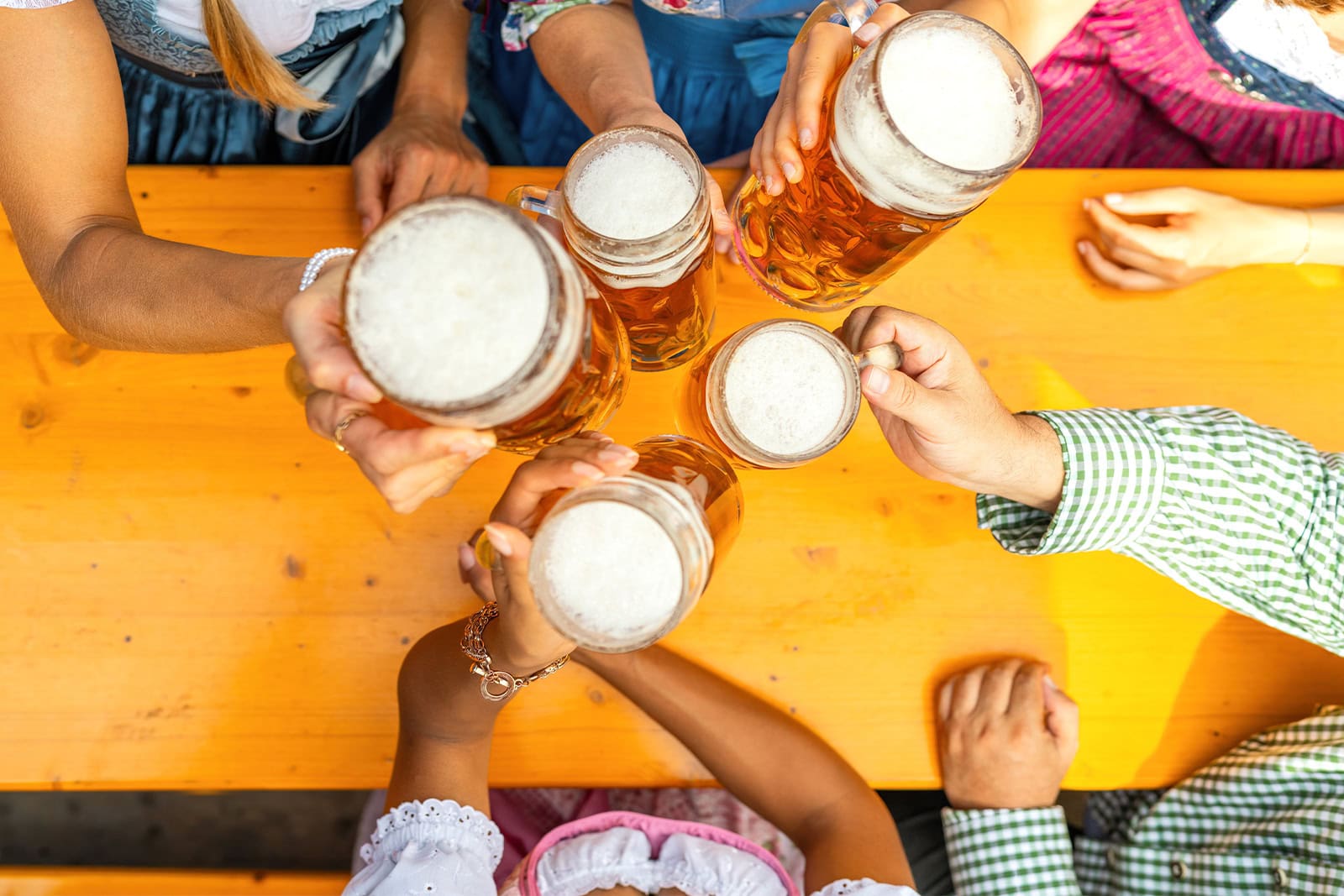 group of friends cheering with beer for oktoberfest