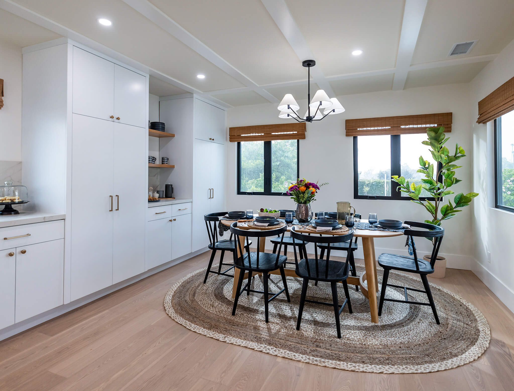 chic cozy dining room area with natural light and contrasting trim windows