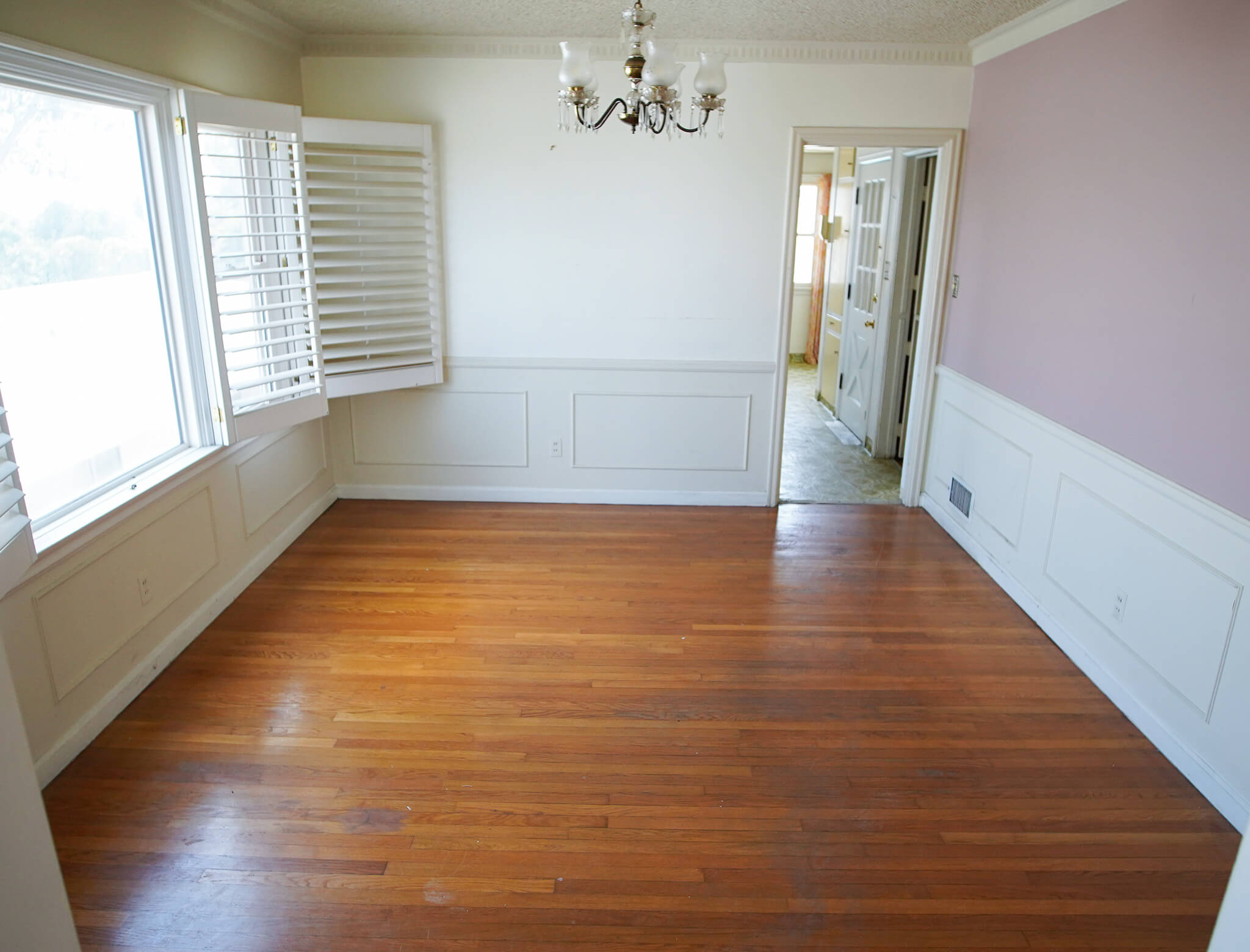 old dining room with dingy walls and floors