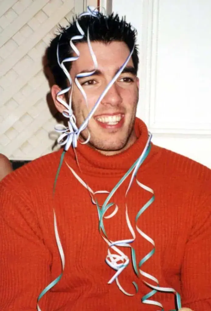 drew with spiked hair and red turtleneck