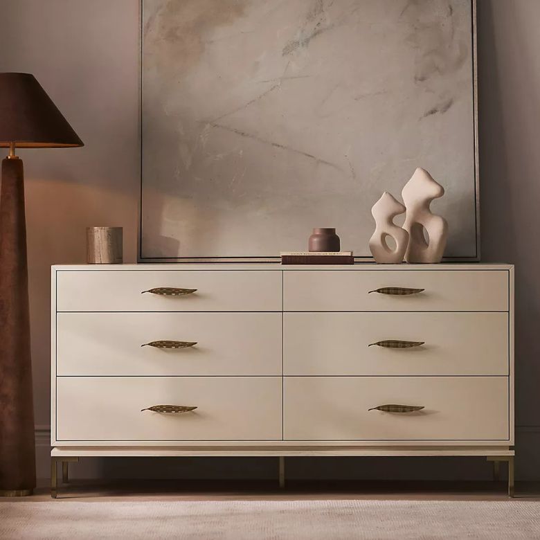 white dresser with leaf drawer pulls