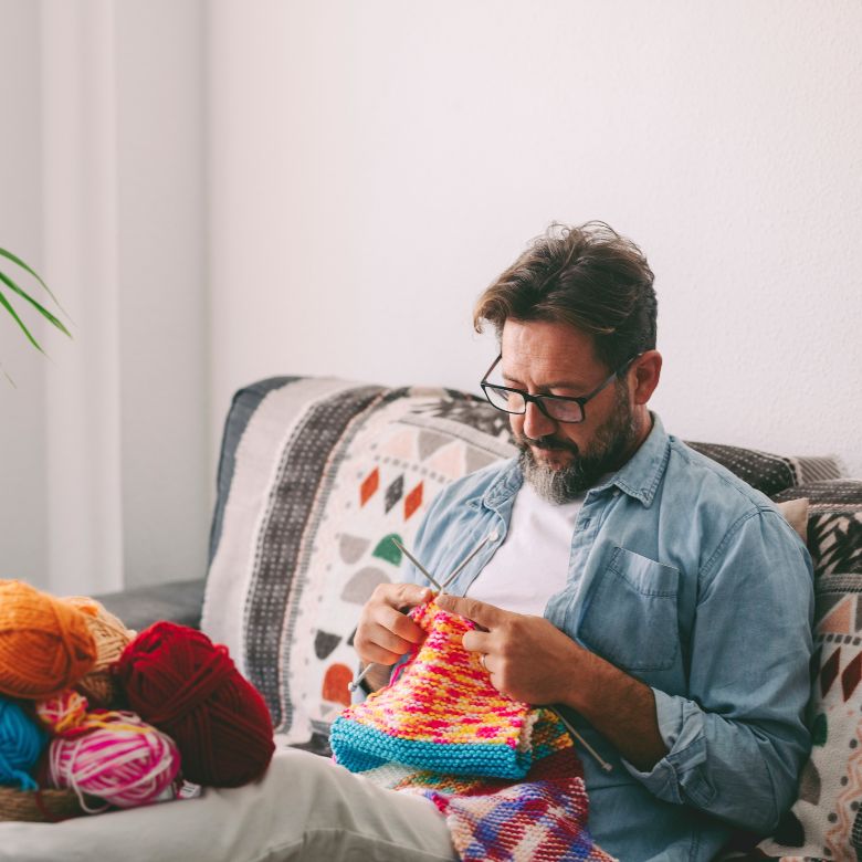 man knitting