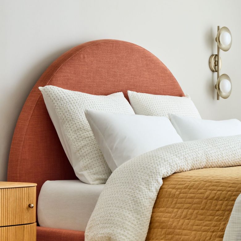 rust-colored rounded headboard