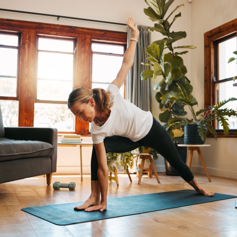 woman doing yoga at home