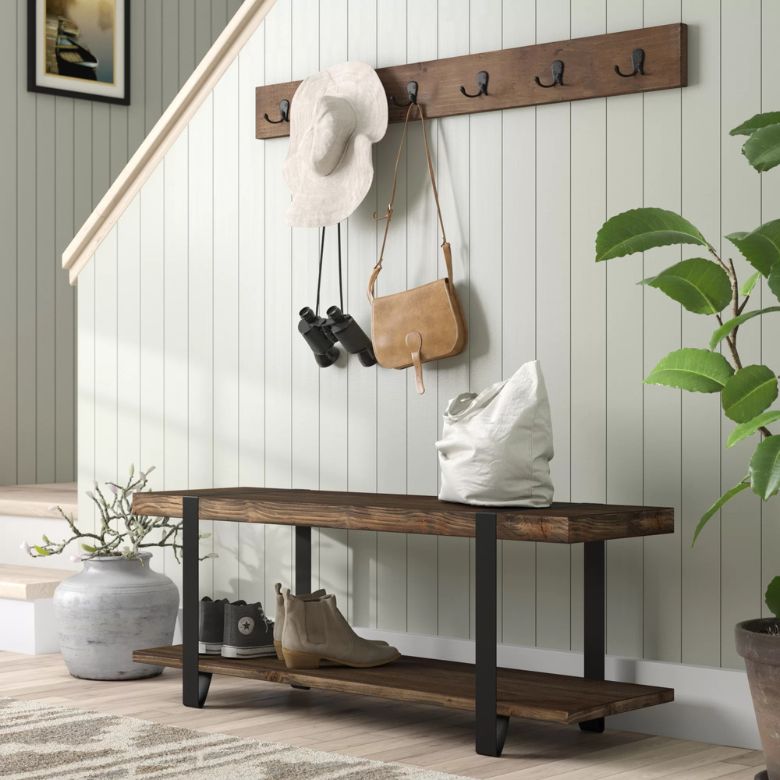 wall-mounted wooden coat hooks and bench
