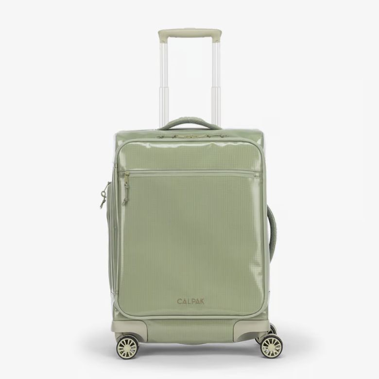 green rolling carry on luggage